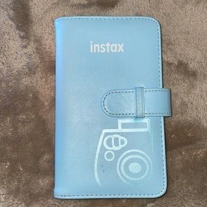 This is a booklet to add instax film pictures.color is a light baby blue.